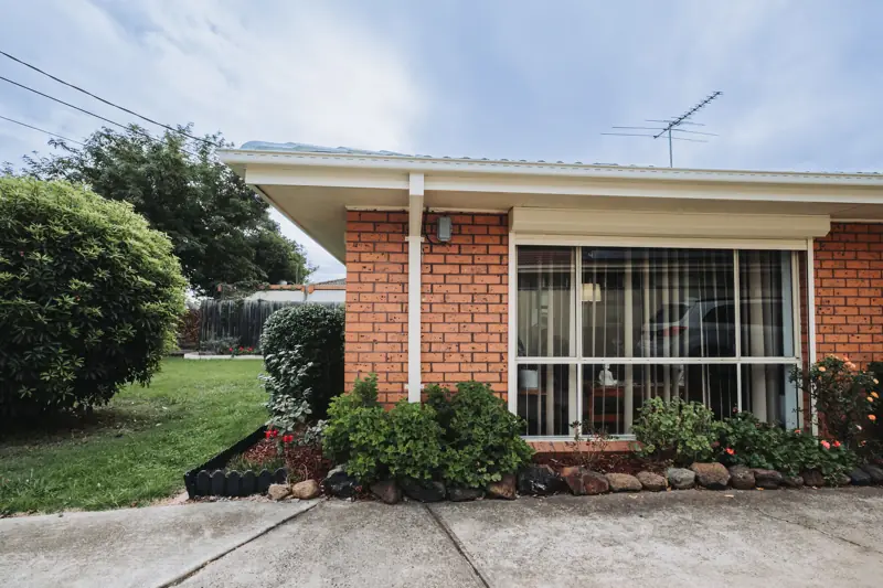 Classic Cream gutters and fascia on a brick unit