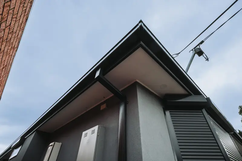 Monument fascia and gutter at the gable apex