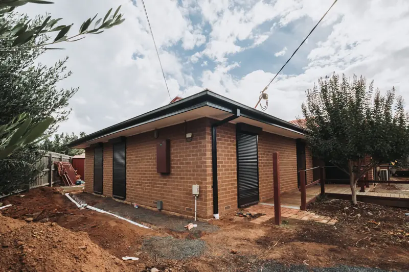 Monument Colorbond gutters on a brick veneer home