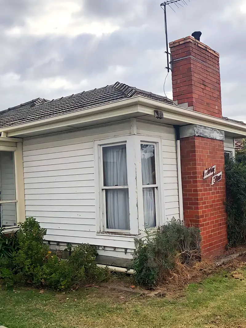 Weatherboard home with roof and gutter work